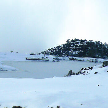 Heavenly Lake frozen solid on Jiaozi Snow Mountain