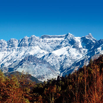 Wintertime view of Jiaozi Snow Mountain's main butte, taken from the visitor's center