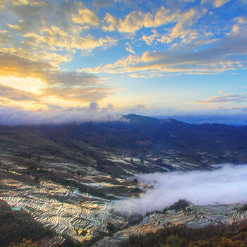 A spectacular sunset reflected by the rice terraces in Yuanyang, Yunnan