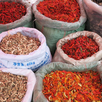 Spicy chilies, mushrooms and lichen for sale at a Yuanyang market (image credit: Chiara Ferraris)