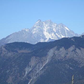 Telephoto lens shot of south face of Haba Snow Mountain, taken from summit ridge of Wenhai Mountain