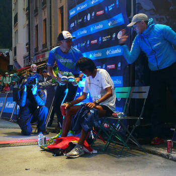 Exhausted Qi Min at the UTMB finish line. He came second but his language problems may have cost him the win (image credit: Pavel Toropov