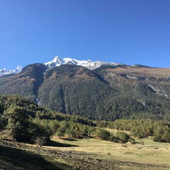 View from Pusa Mountain meadows to Haba Snow Mountain